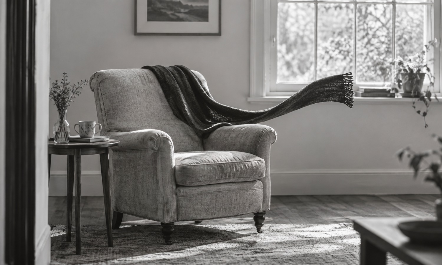 An empty chair with a scarf extending unsupported into the room.