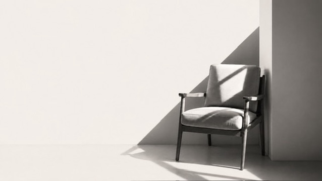 A single armchair in a quiet, sunlit room
