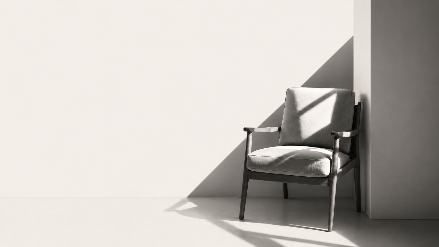 A single armchair in a quiet, sunlit room