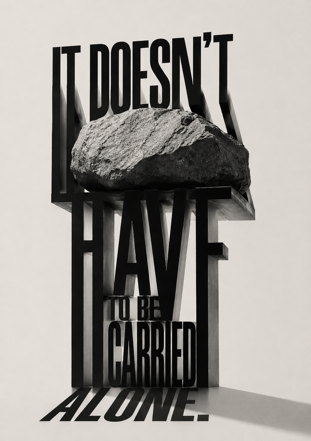 A heavy rock resting on a shelf built from giant 3D letters spelling ‘It doesn’t have to be carried alone.’