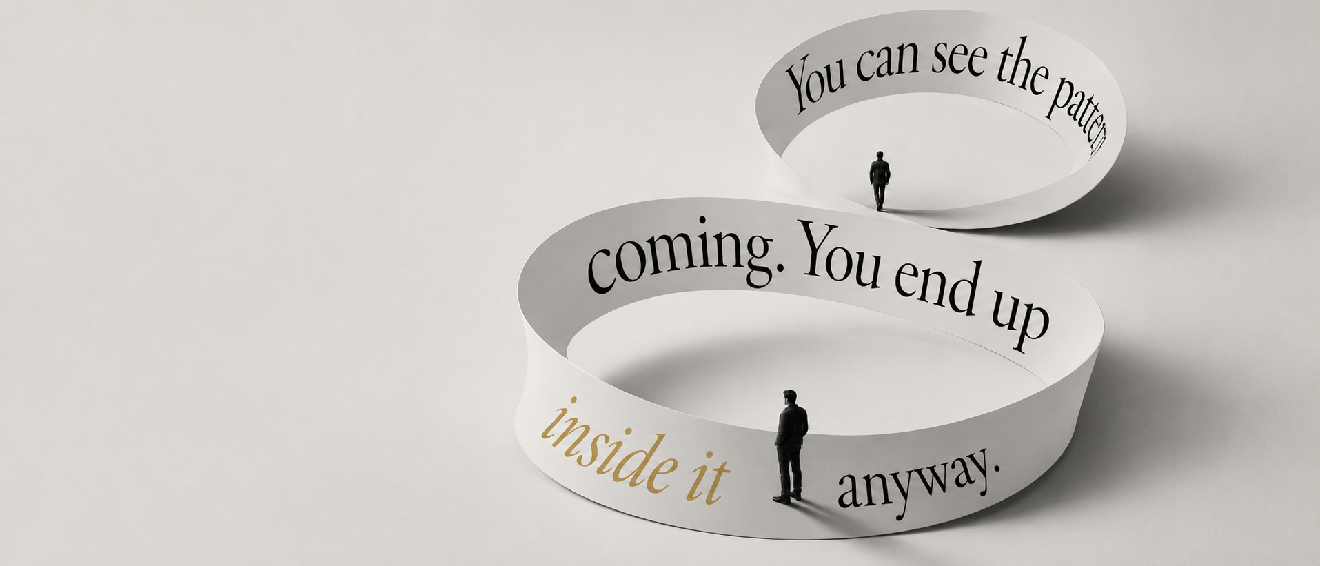 A figure-eight loop of paper reading ‘You can see the pattern coming. You end up inside it anyway’, with two small figures walking its track.