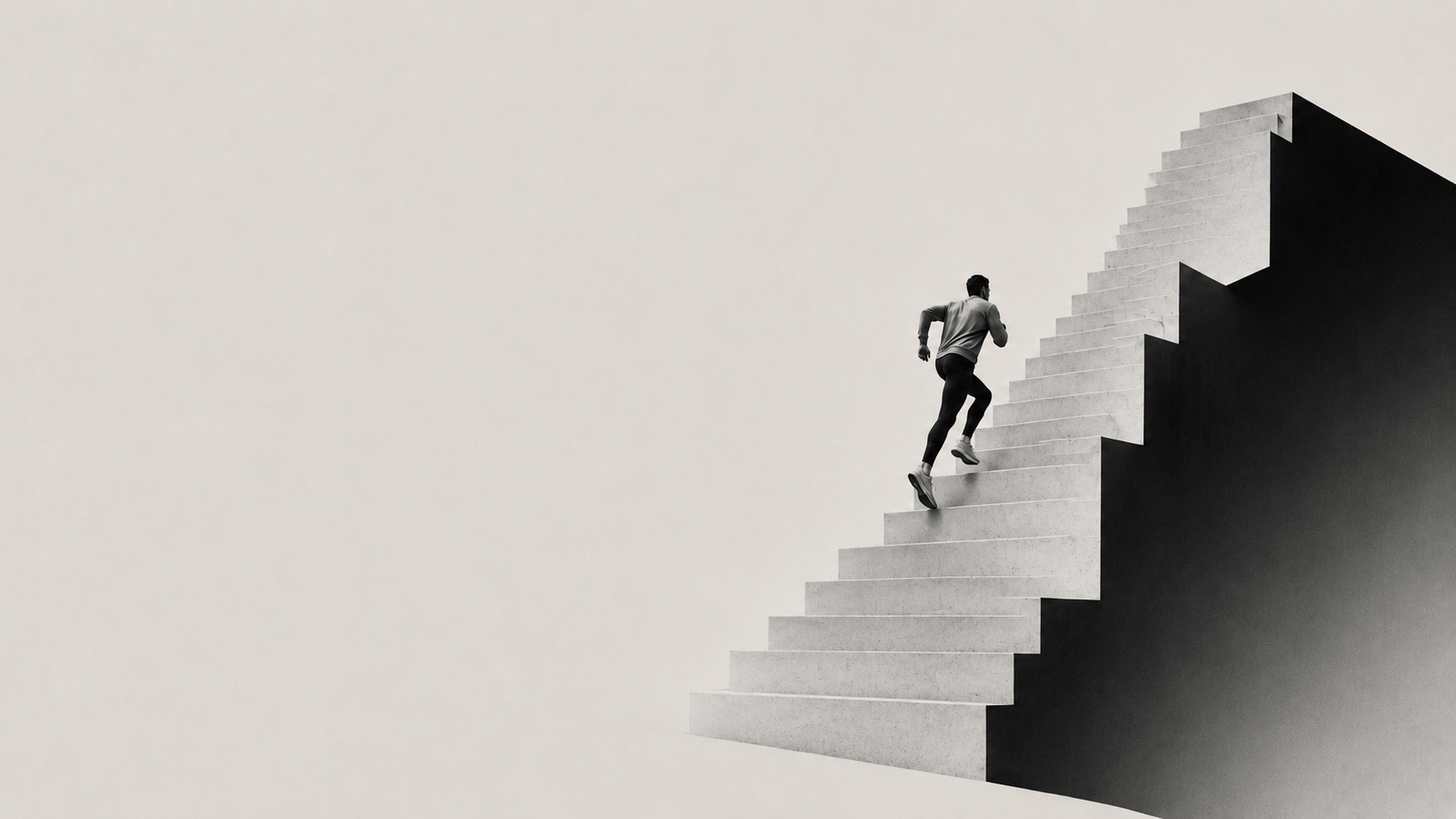 A runner climbing a monumental concrete staircase that rises into a dark block, a wide expanse of pale wall to the left.